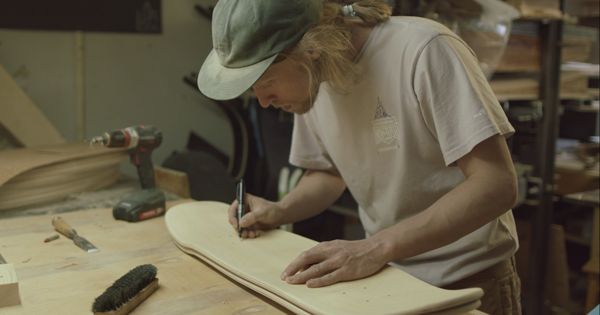 John, a skateboard maker, in his workshop